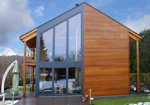 Fertigbauhaus / aus Massivholz-Block / modern / aus Holz