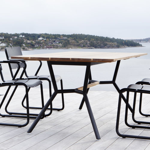 Moderner Esstisch - REEF - OASIQ - Teakholz / Aluminium / Edelstahl