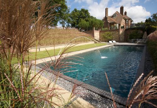 Natürliches Schwimmbecken - LANDSCAPED GARDENS - GUNCAST SWIMMING POOLS - für Außenbereich / erdverlegt / Stein