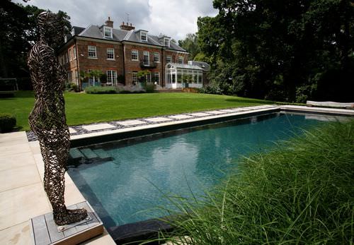 Natürliches Schwimmbecken - SURREY - GUNCAST SWIMMING POOLS - für Außenbereich / erdverlegt / Beton