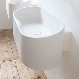 Wand-Waschbecken - FUSE - NotOnlyWhite - Cristalplant® / mit integrierter Waschtischplatte / handgefertigt