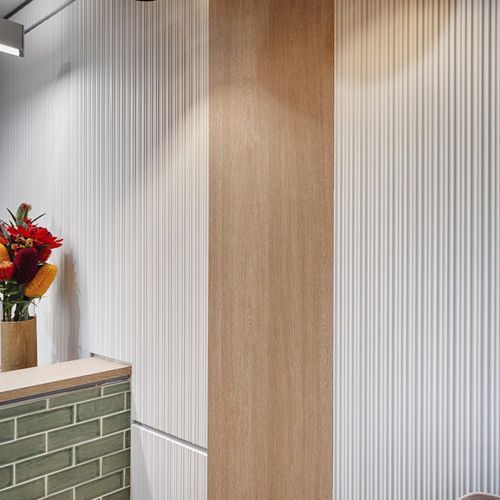 Dekorplatte für Wand - CORRUGATED - STONINI - für Innenausbau / leicht / Brandschutz