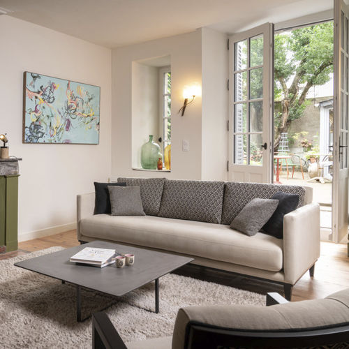 Modernes Sofa - SWANN - RALPH M. - Stoff / mit abnehmbarem Kissen / mit Armlehnen