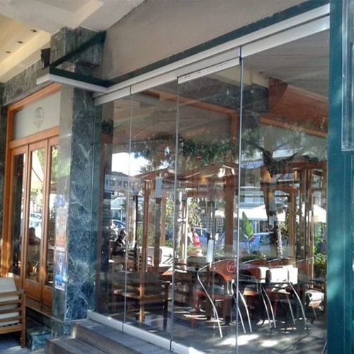 Paneel-Vorhangfassade - Atrio Glass Doors - aus Aluminium und Glas / Dekor / transparent