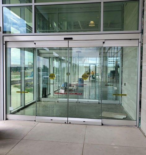 Aluminium-Schiebesystem - SL500 CGL - ASSA ABLOY Entrance Systems - Glastüren / mit versteckten Laufrollen / für Gewerbegebrauch