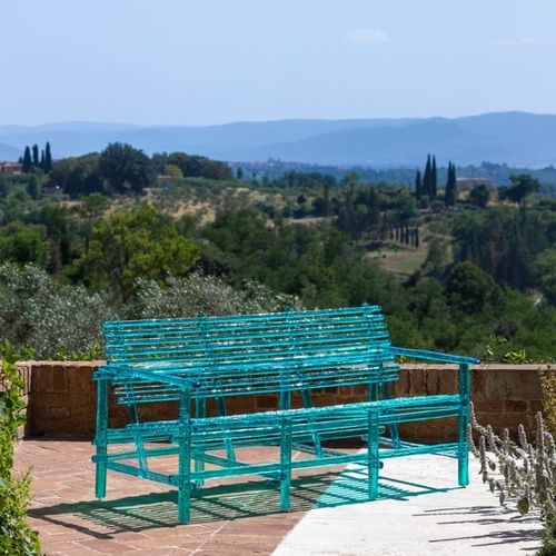 Moderne Gartenbank - A'MARE - edra - Polycarbonat / mit Rückenlehne / mit Armlehnen