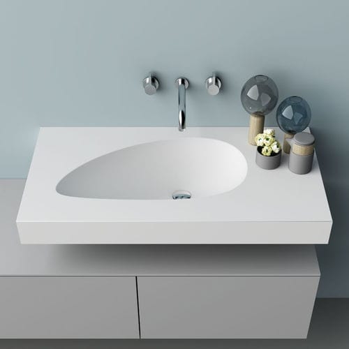 Eingebautes Waschbecken - WING - PLANIT - Corian® / mit integrierter Waschtischplatte / gebogen