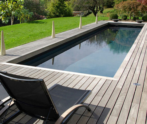 Schwimmbahn-Schwimmbecken - REFLETS NOIRS - PISCINES CARRE BLEU - für Außenbereich / erdverlegt / Stein
