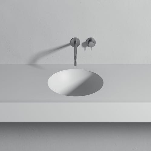 Einbauwaschbecken - CALIMERO - Rexa Design - Corian® / mit integrierter Waschtischplatte / kreisförmig