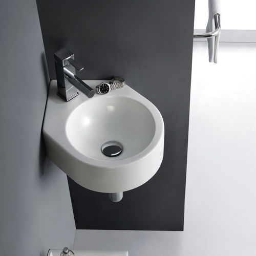 Wand-Waschbecken - BRISTOL - Bath Collection S.L. - Porzellan / für Eckeinbau / modern