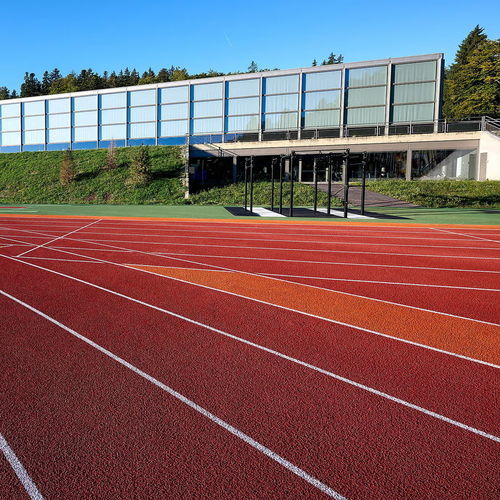 Sportboden für Außenbereich - RE-TOPPING SYSTEMS - Polytan GmbH - Elastomer / Gummi / für Schulen