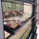 Lamellen-Sonnenschutzlamelle / Glas / für Fenster / vertikal