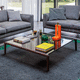moderner Couchtisch / Metall / Glas / Gestell aus Massivholz