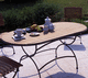 moderner Tisch / Teakholz / Gestell aus Metall / oval