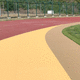 Sportboden für Außenbereich / Gummi / für Sportplätze / dauerhaft