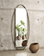 wandmontierter Spiegel / modern / oval / Stahl