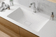 Einbauwaschbecken / Corian® / mit integrierter Waschtischplatte / Mischbatterie
